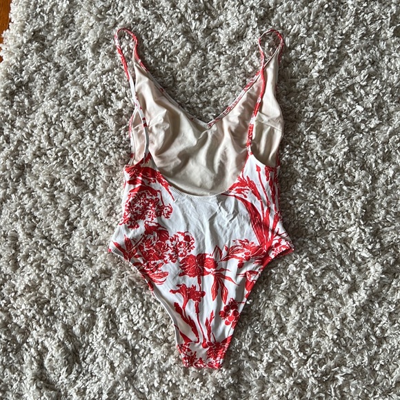 Red and white patterned one piece swimsuit from H&M, size 6. Moderate coverage. - Picture 2 of 3